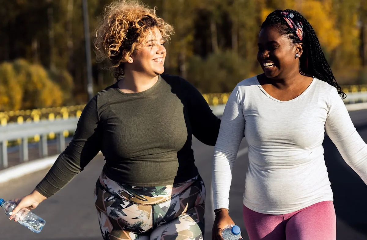 Two,Young,Plus,Size,Women,Jogging,Together.